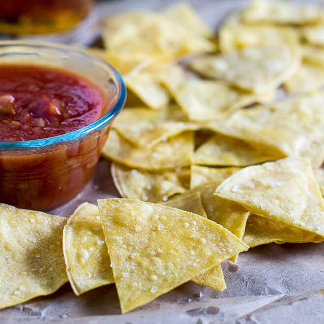 Bake your own Homemade Tortilla Chips in 10 minutes! Extra thin tortillas ensure crunchy snacks every time, perfect for salsa and guacamole.