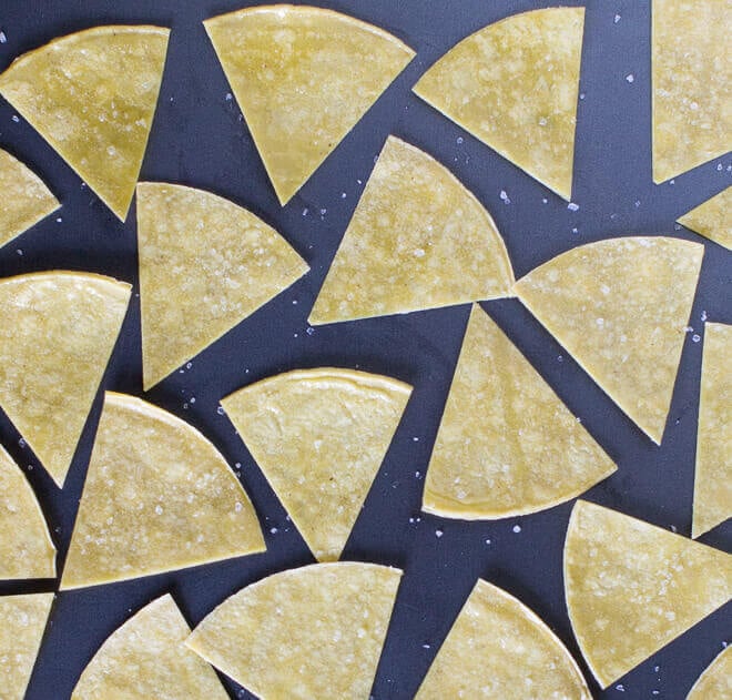 Bake your own Homemade Tortilla Chips in 10 minutes! Extra thin tortillas ensure crunchy snacks every time, perfect for salsa and guacamole.