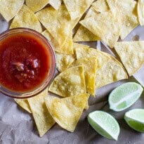 Bake your own Homemade Tortilla Chips in 10 minutes! Extra thin tortillas ensure crunchy snacks every time, perfect for salsa and guacamole.