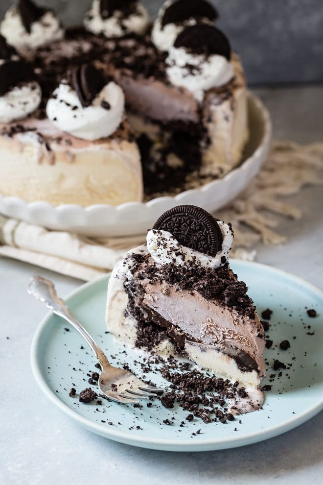 A slice of easy ice cream cake on a light blue plate.