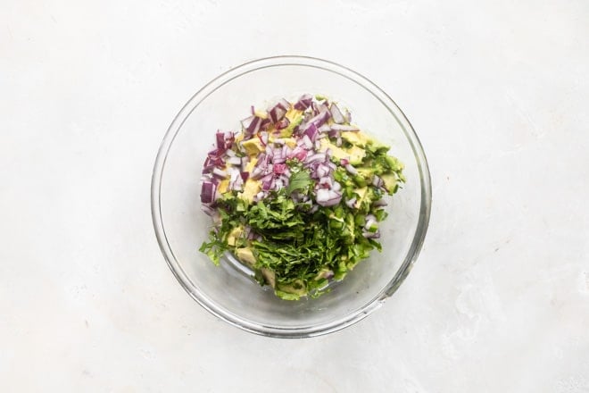 This Chipotle Guacamole recipe is the real deal. With just seven ingredients and a few minutes, you can enjoy as much Chipotle Guacamole at home as you can mash!