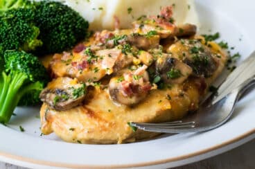 Alice Springs chicken on a plate with broccoli.