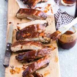 Barbecue ribs on a wood cutting board.