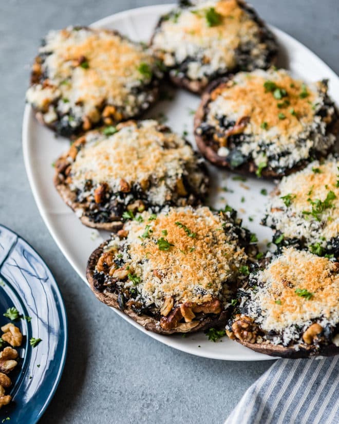 Stuffed Portobello Mushrooms on a white platter.