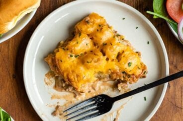 Cowboy casserole on a white plate with a silver fork.
