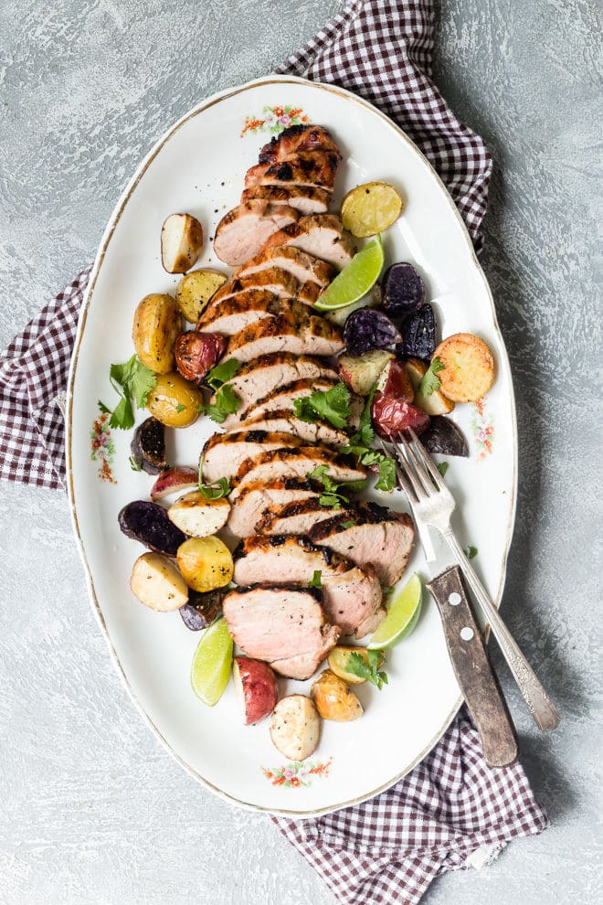 Slices of grilled pork tenderloin on a platter.