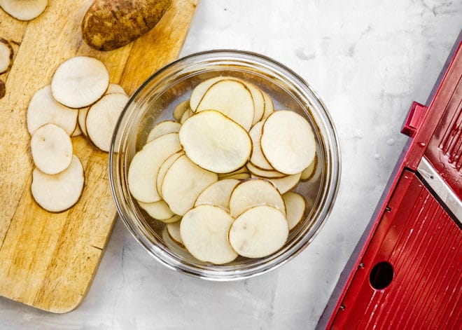 Slices of potato cut before being made into potato chips.