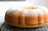 A hot milk cake on a cooling rack.