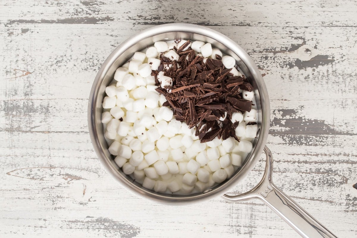 Marshmallows in chocolate in a saucepan to make chocolate mousse.