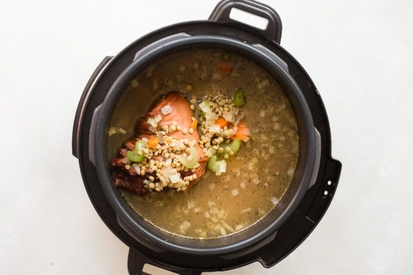 This Ham and Lentil Soup recipe is perfect for chilly weather and cooks up in about an hour; all you need is a loaf of French bread for a cozy winter’s feast. Put your leftover ham to work and make it on the stove, in a pressure cooker, or in your crockpot!