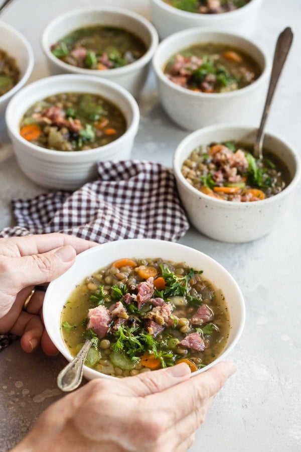This Ham and Lentil Soup recipe is perfect for chilly weather and cooks up in about an hour; all you need is a loaf of French bread for a cozy winter’s feast. Put your leftover ham to work and make it on the stove, in a pressure cooker, or in your crockpot!