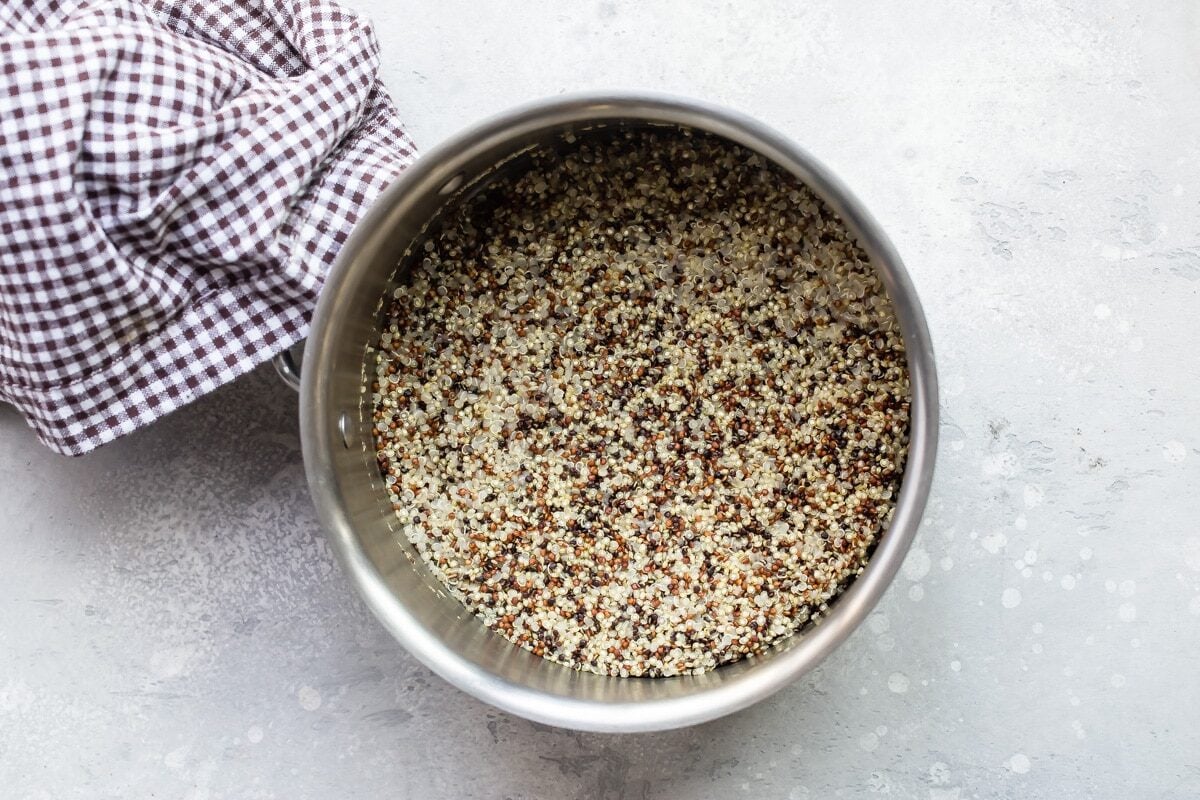 A silver saucepan with quinoa in it.