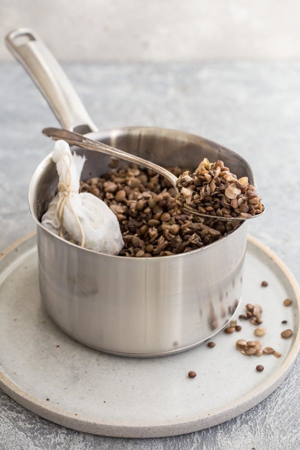 Lentils in a silver pot.