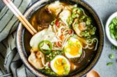Chicken ramen in a bowl with chopsticks.