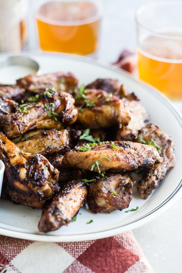 A summer barbecue recipe for Smoked Chicken Wings will take your wing game to new, spectacular heights. Fire up that charcoal smoker; here's everything you need to know to make the best chicken wings ever!