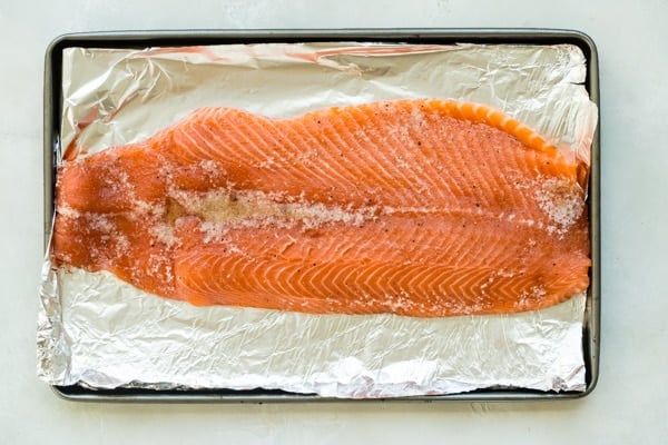 An overhead shot of salmon on foil.