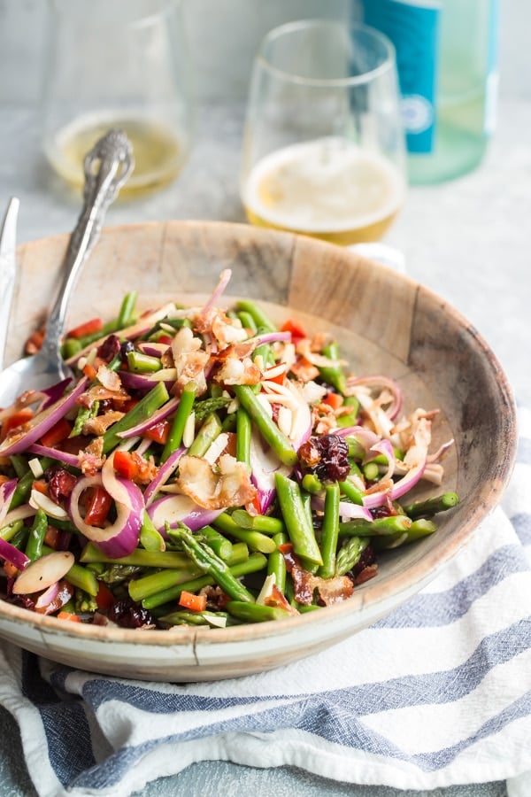 Asparagus salad in a wooden bowl.