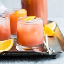 A new mother mocktail in glasses on a silver platter.