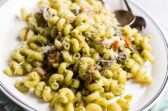 Pesto cavatappi on a white platter.