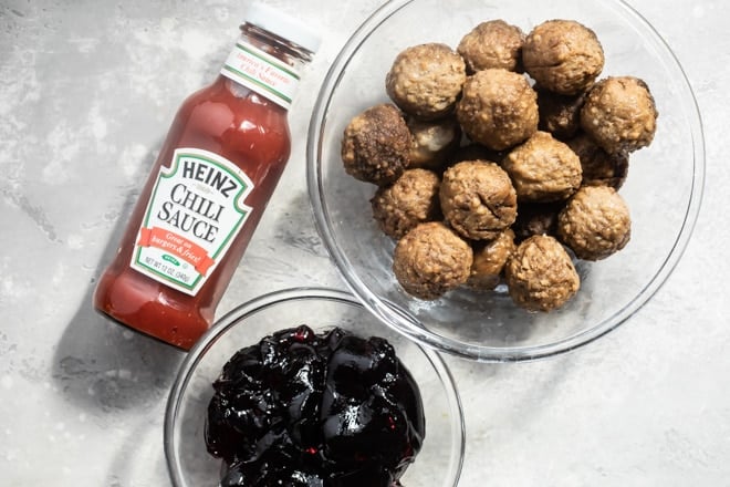 Meatballs, grape jelly, and chili sauce.