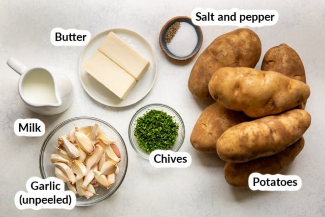 Garlic mashed potato ingredients in bowls and labeled.