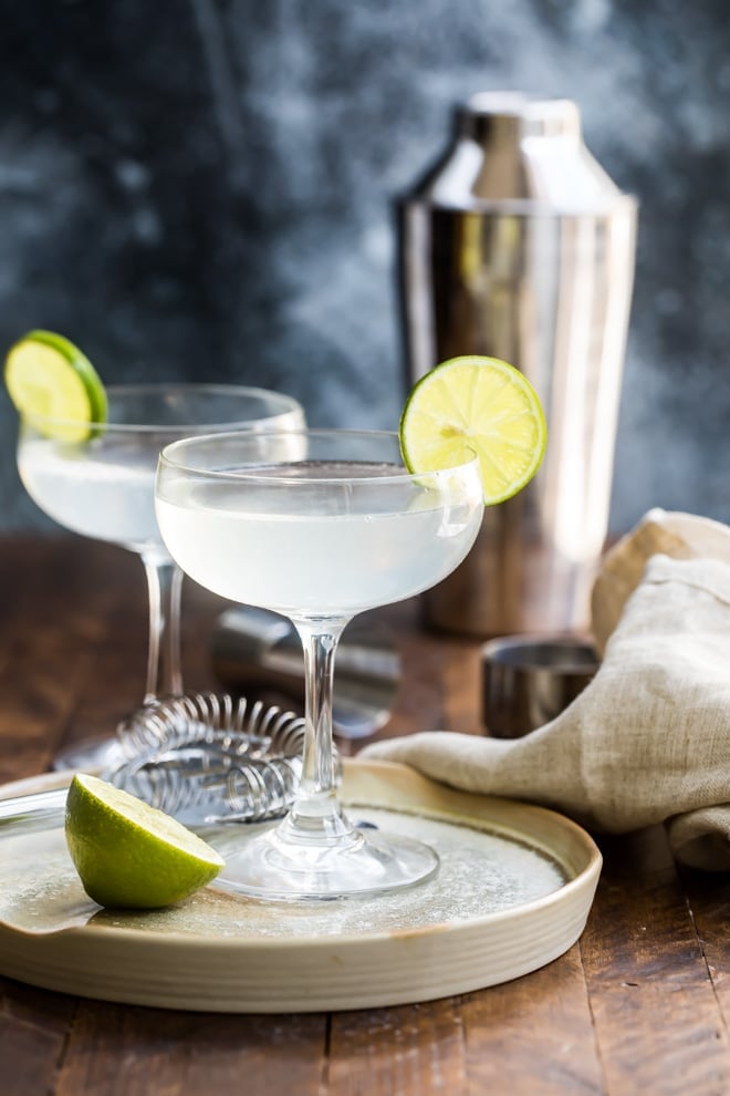 Gimlets in clear stemmed glasses.