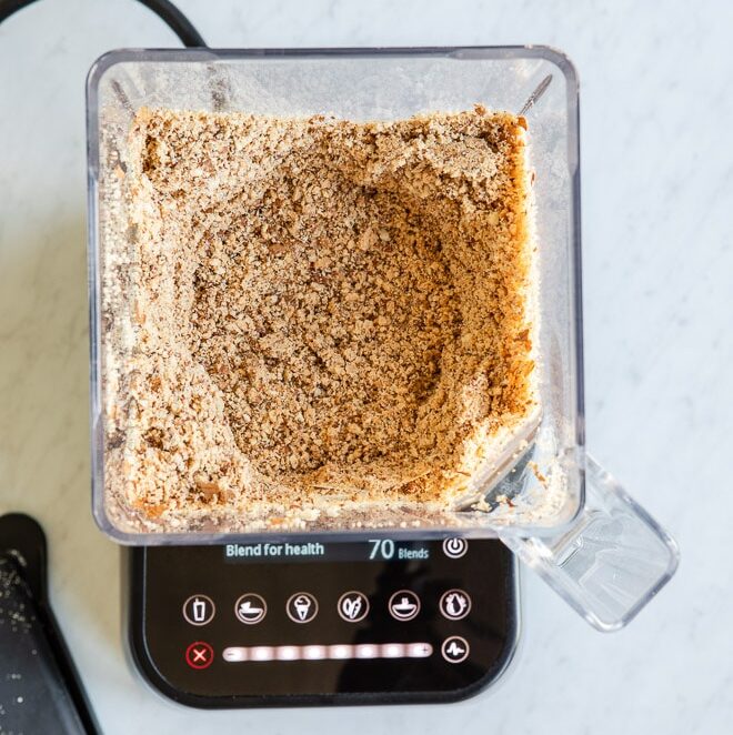 Chopped almonds in a blender.