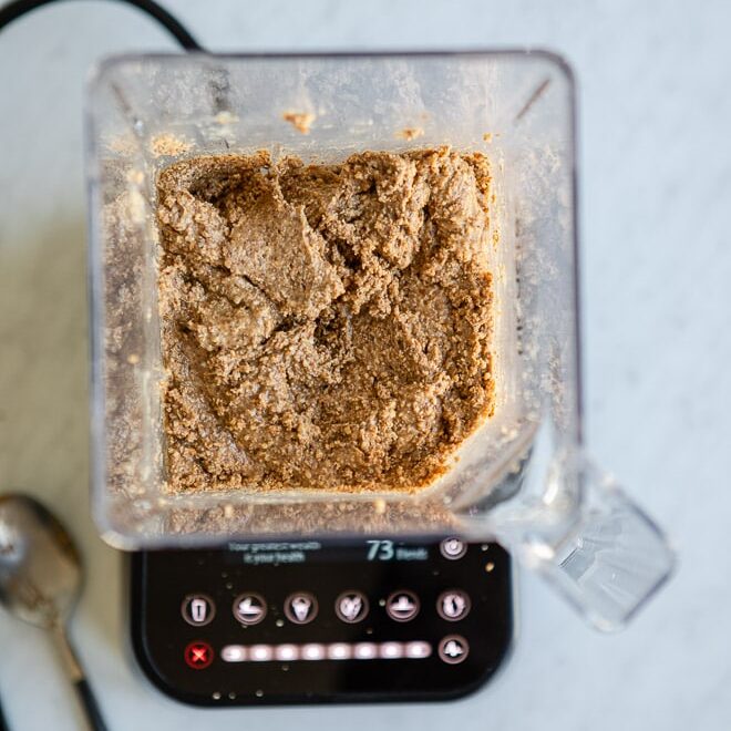 Pre-blended almond butter in a blender.