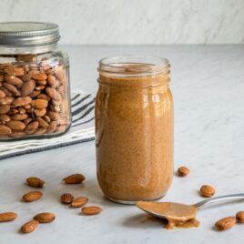 Almond butter in a clear jar.