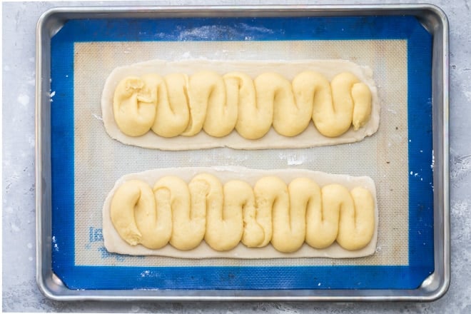 Precooked danish kringle on a baking pan.