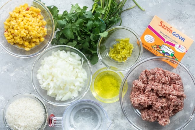 One pot Puerto Rican rice ingredients in various bowls.