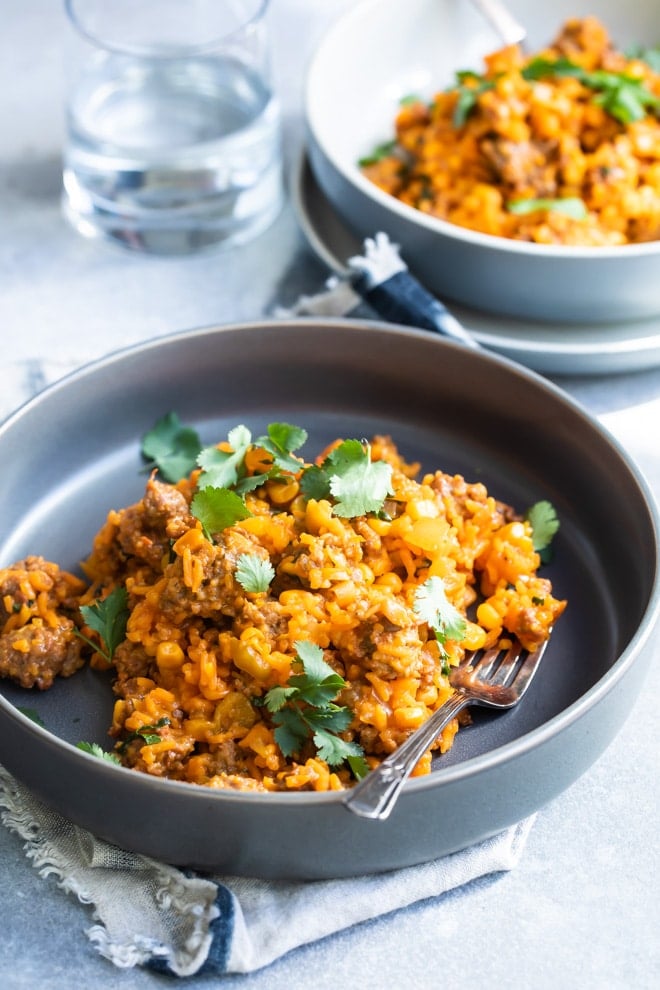 One pot Puerto Rican rice in blue bowls.