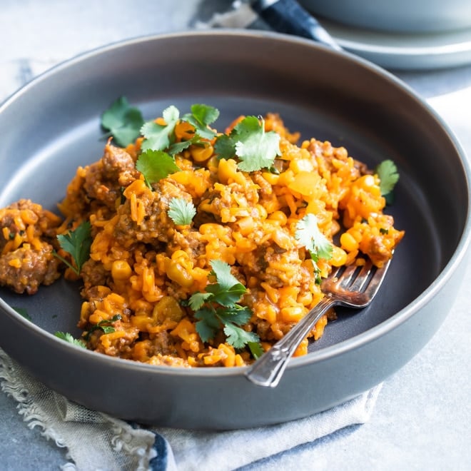 One pot puerto rican rice in a navy bowl.