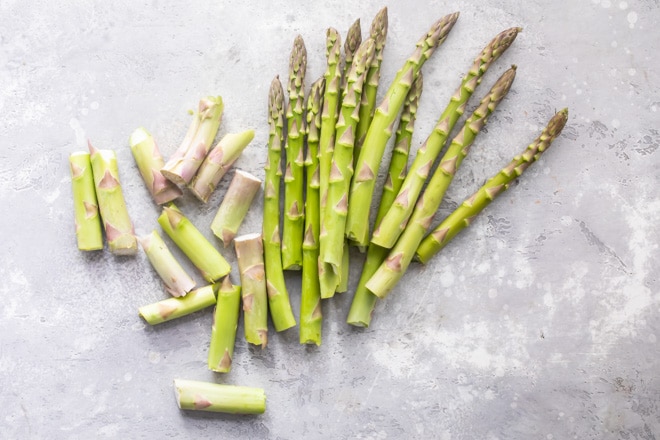 Snapped raw asparagus.