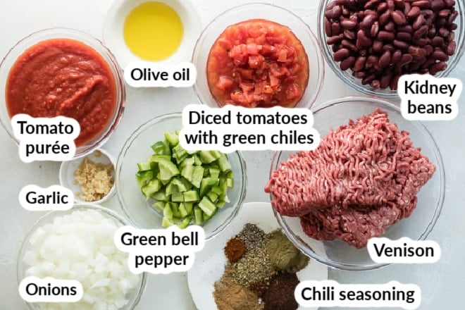 Labeled venison chili ingredients in bowls.