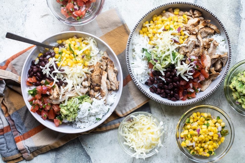 Chipotle burrito bowls in white bowls.