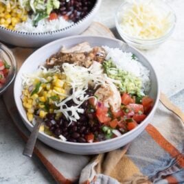 A chipotle burrito bowl in a white bowl.