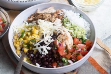A chipotle burrito bowl in a white bowl.
