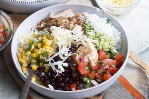 A chipotle burrito bowl in a white bowl.