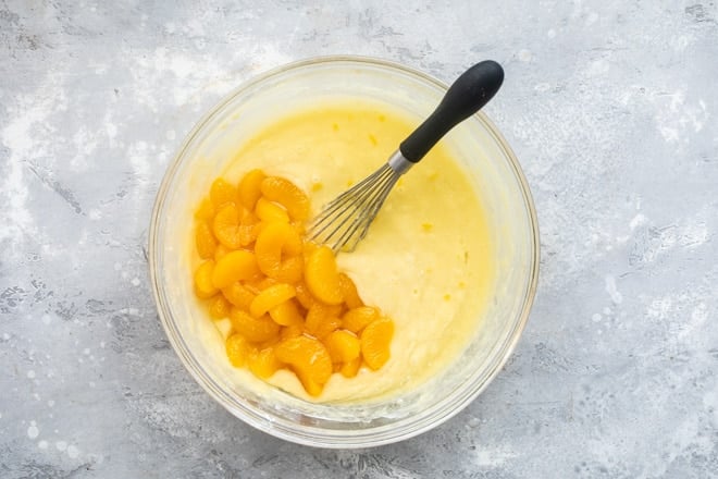 Hawaiian wedding cake batter in a clear bowl.
