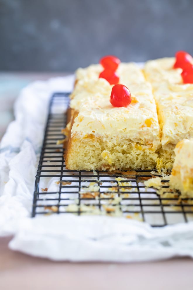 Hawaiian wedding cake slices on a cooling rack.