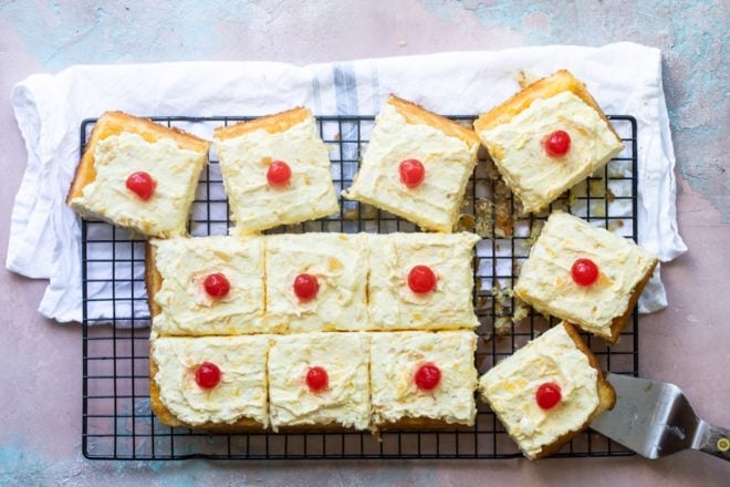 Hawaiian wedding cake slices on a cooling rack.