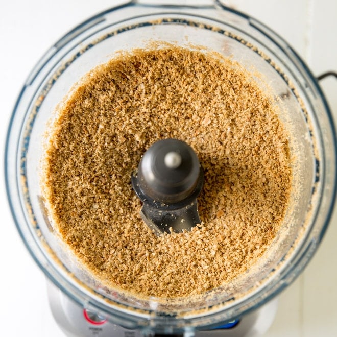 Sunflower seeds being ground in a food processor.