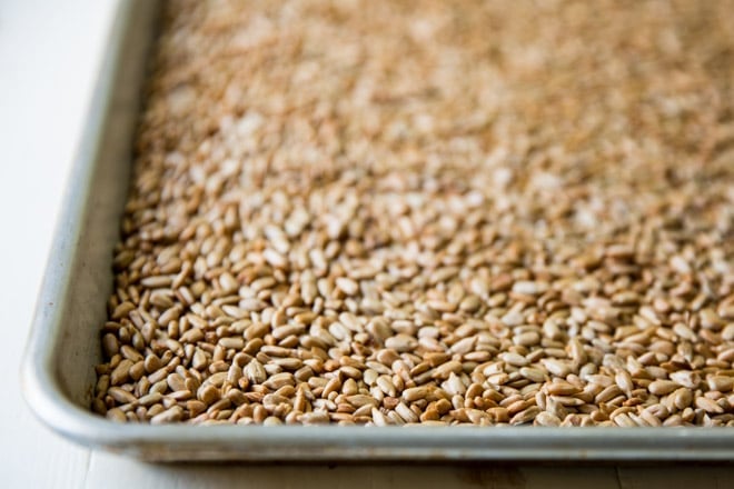 Sunflower seeds on a baking sheet.