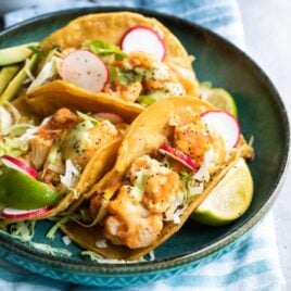 Cauliflower Tinga tacos on a blue plate.