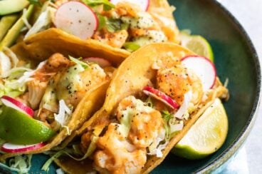 Cauliflower Tinga tacos on a blue plate.