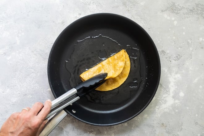 Make crispy taco shells or chips exactly once at home, and you’ll never go back to store-bought. They’re that good! Here’s how to fry tortillas, an easy technique I learned in Mexico, for the crunchiest, crackliest tacos, chips, and tostadas ever.