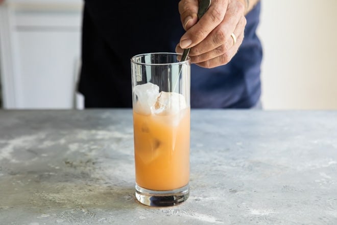 Seabreeze ingredients being mixed together in a clear glass.