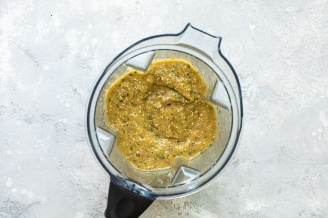 Tomatillo green chili salsa in a blender.
