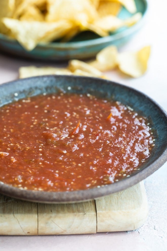 Salsa de Birria in a gray shallow serving bowl.